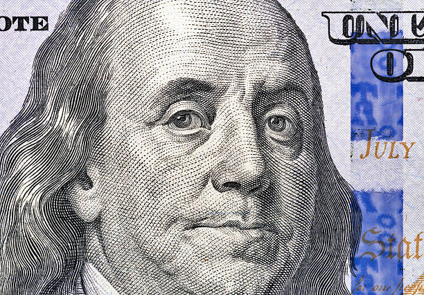 istock Benjamin Franklin portrait on one hundred dollar bill closeup 621856750