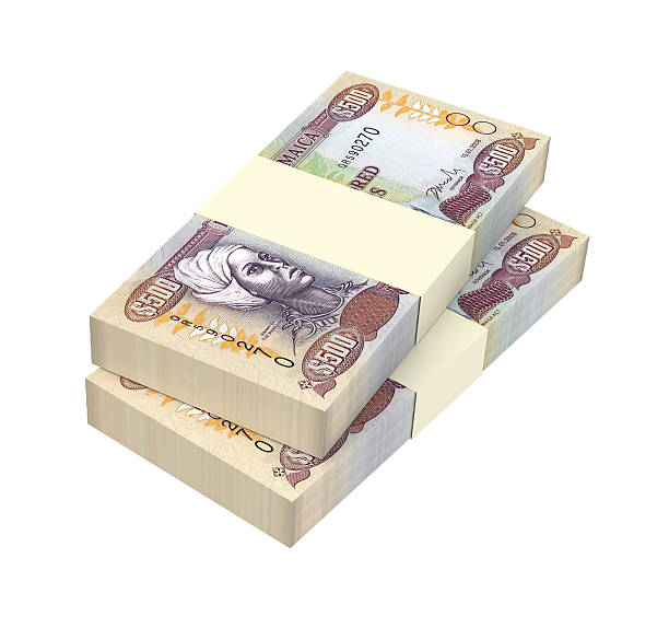 istock Jamaican dollar bills isolated on white background. 621857314