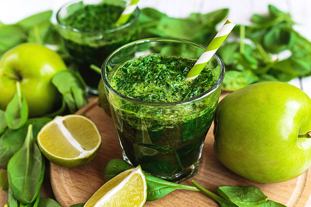 istock Healthy green smoothie with spinach, lime and apple 621857842