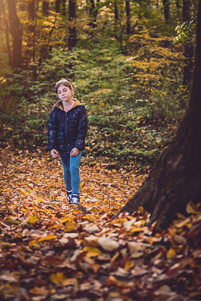 Girl hiking in colorful autumn forest