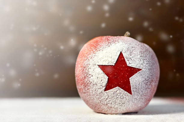 istock Christmas card with Christmas apple and snow 621858336