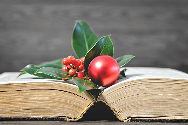 istock Christmas card with Christmas decoration and old book 621859684