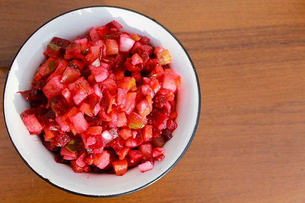 istock Russian beet salad vinaigrette in rustic bowl on wooden table 621860900