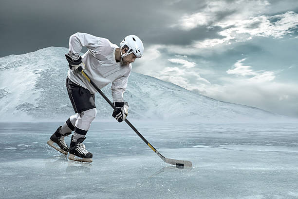istock Ice hockey player on the ice in mountains 621862276