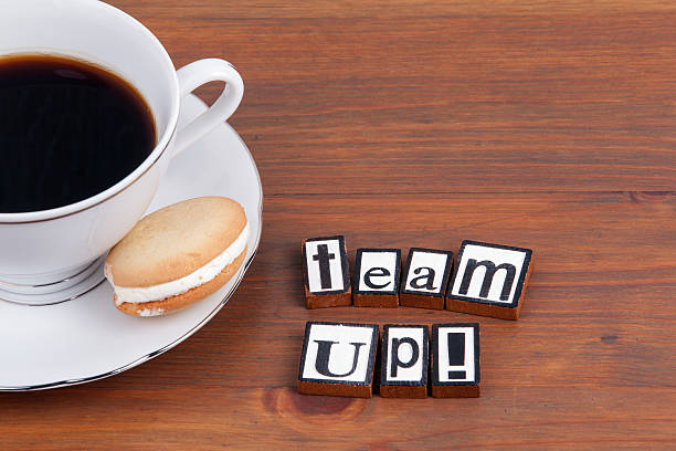 istock Team Up! On wooden table coffee mug, cookie 621892878