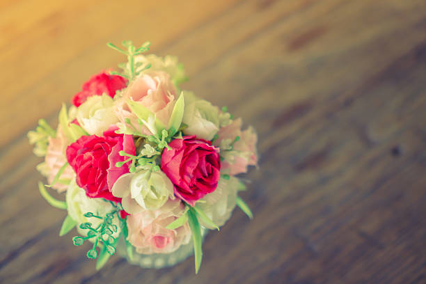 Bunch of beautiful flowers on table (Filtered image processed vintage effect)