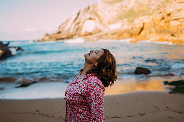 istock woman at the sea 621893642