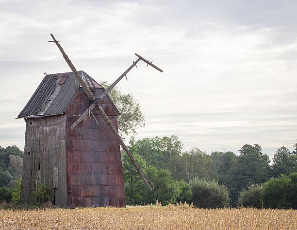 istock Kawnice, Poland. Old ruined windmill on the field. 621895778