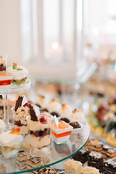 istock Cold desserts in glasses stand on tired dish 621895882