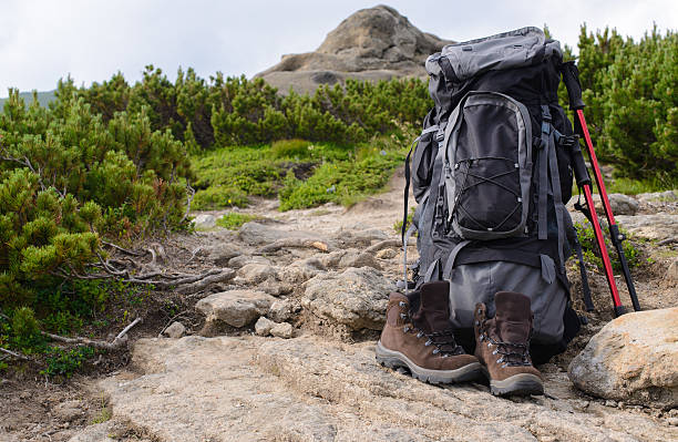 istock Perfect camping. Close up of backpack rucksack in mountains. Cam 621896890