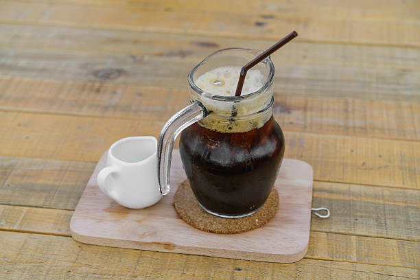 istock Iced cold coffee on a wooden table 621897112