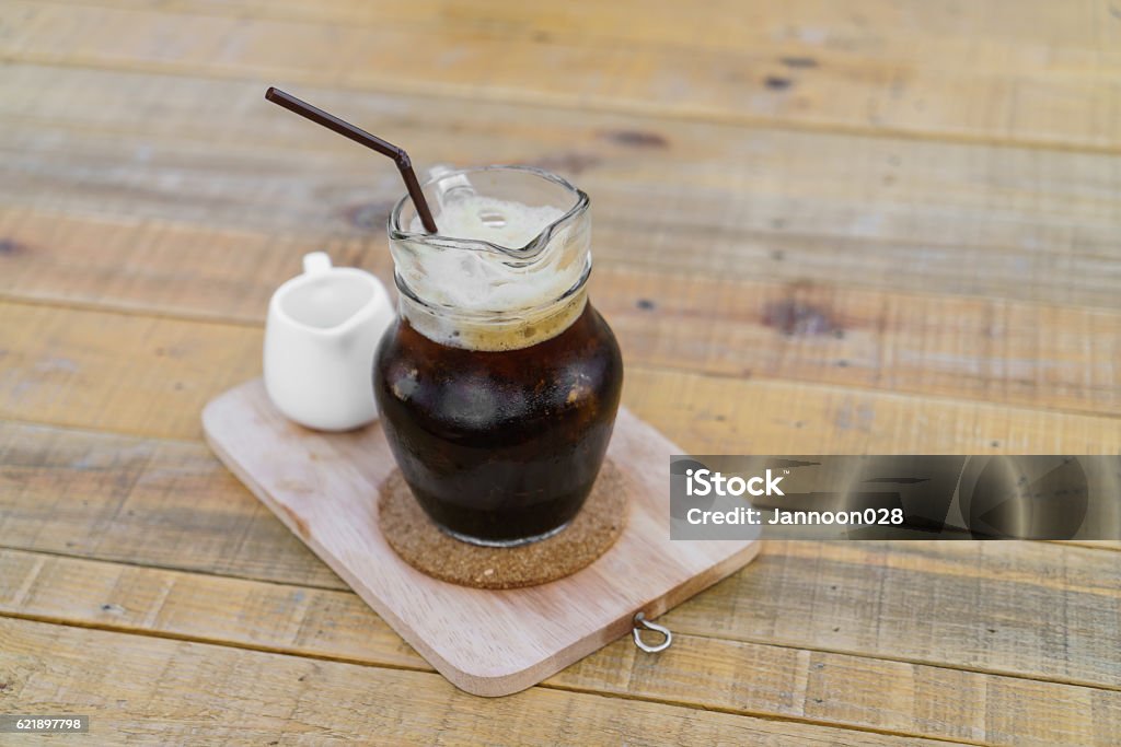 Iced cold coffee on a wooden table Cafe Stock Photo