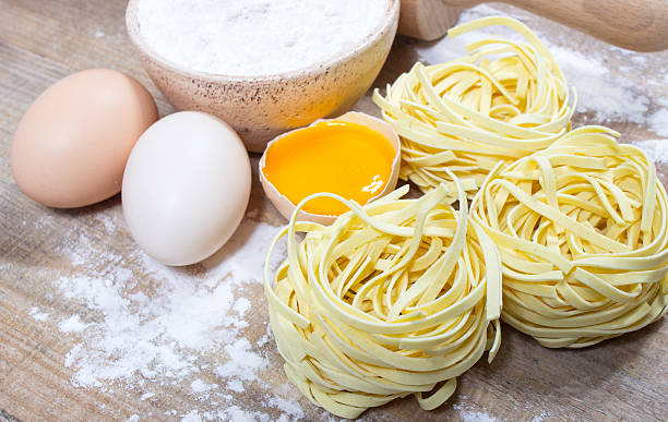 istock Raw homemade pasta and ingredients for pasta. 621897842