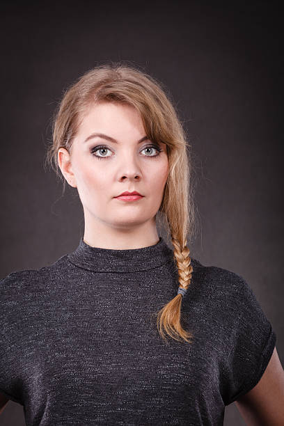 istock Young blonde pensive woman. 621899008