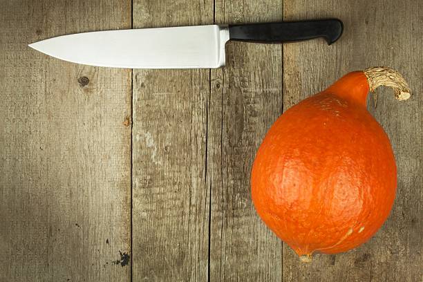 istock Ripe pumpkins Hokkaido. Autumn vegetables on the kitchen table. 621899370