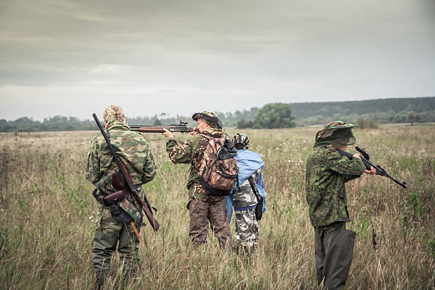 istock Hunters preparing for hunting in rural field in overcast day 621900212