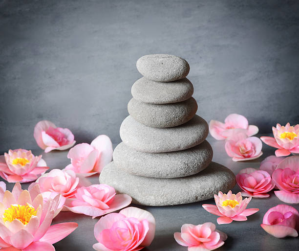 istock stones balance with flower lily on grey background 621900980