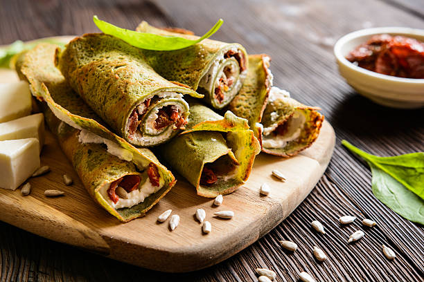 Spinach pancakes stuffed with Feta, curd and sun dried tomato