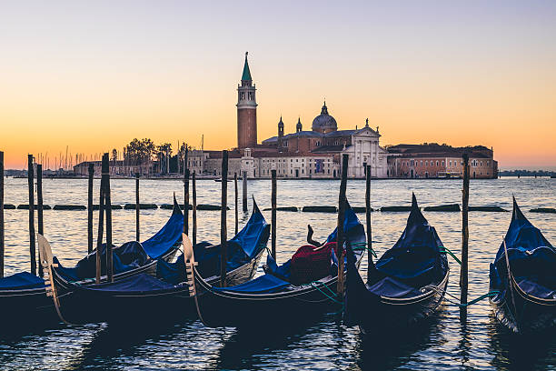 istock Venice gondolas and San Giorgio basilica in cross processed styl 621902760