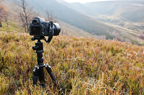 istock Modern professional dslr camera on a tripod, outdoor photography 621903200