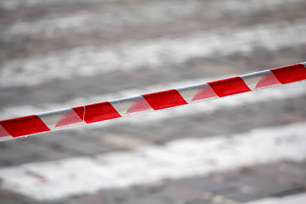 istock Fencing red and white ribbon which prohibits movement. Danger 621907402