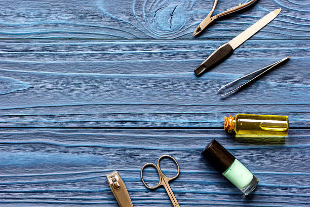istock nail polish and manicure set on dark wooden background 621907698