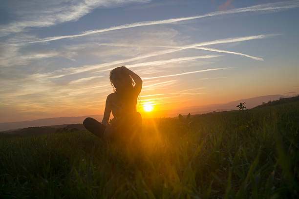 istock Woman Silhouette in the field 621907946