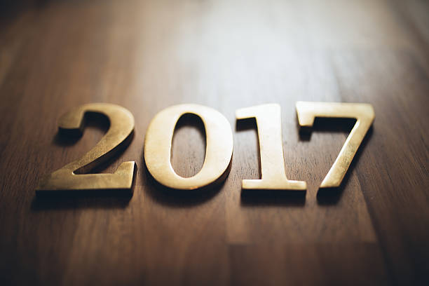 istock New year 2017 gold text on wood 621909222