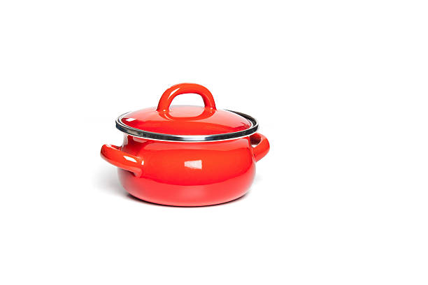 istock Red cast iron cooking pot, isolated on white background. 621909358