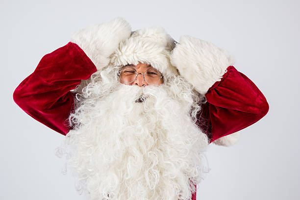 istock Santa Claus in eyeglasses put hands on head 621910178
