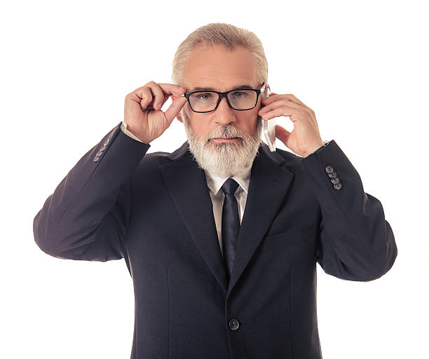 istock Handsome mature businessman with gadget 621911630