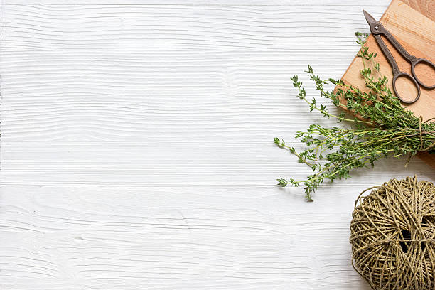 istock fresh herbs preparation to be dried top view wooden background 621912012