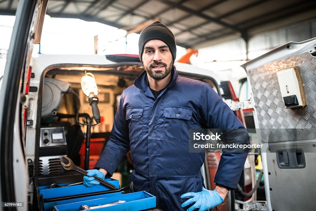 mechanic technician on a garage Plumber Stock Photo