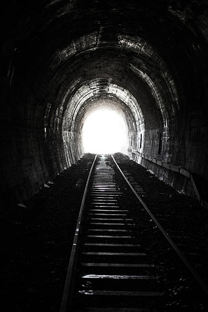 istock Bright Light and the End of an Old Railway Tunnel 621914198