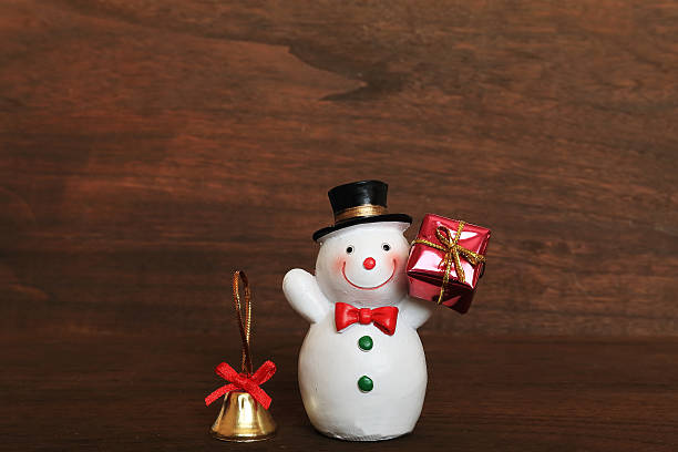 istock Snowman and gift and Bell 621914214