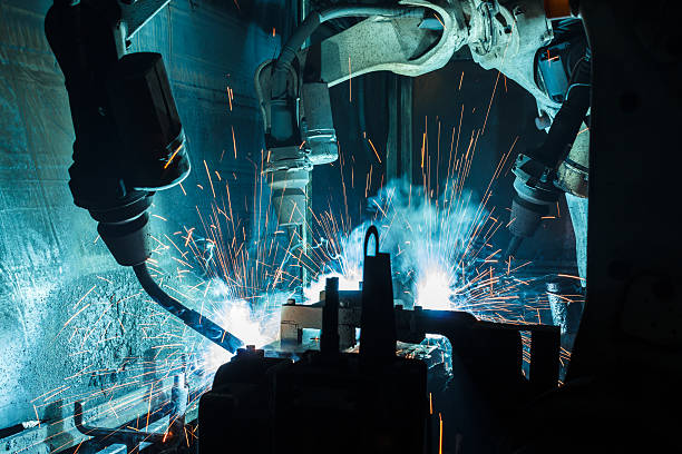 istock Welding robots movement in a car factory 621917684