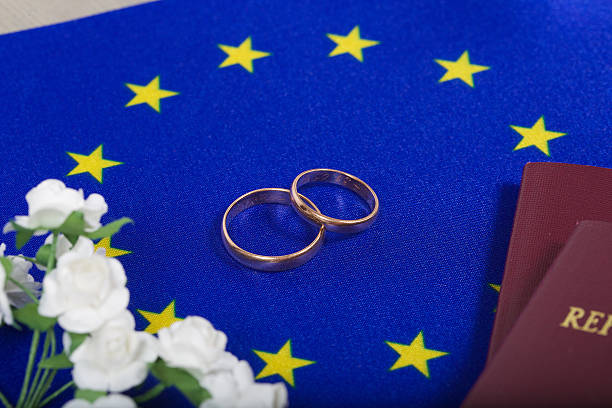 istock Flag of EU ,two marriage rings,passes. Top view 621918746