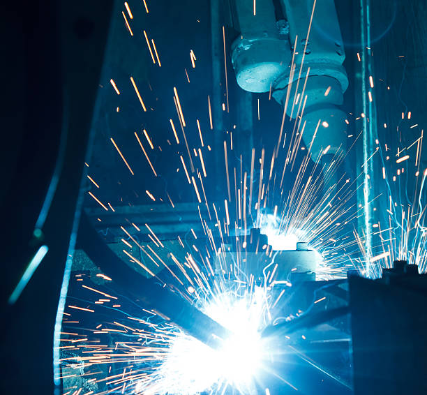 istock Welding robots movement in a car factory 621918762