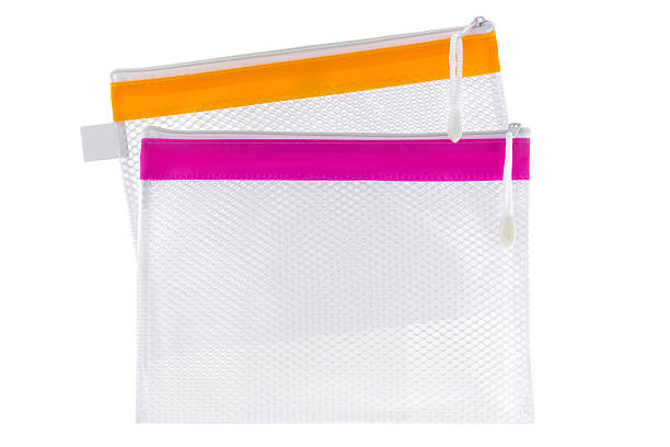 Transparent clear Plastic PVC net bag isolated on white background Transparent clear Plastic PVC ideally used as cosmetic bag, stationery pencil case, document file isolated on white background make up bag stock pictures, royalty-free photos & images
