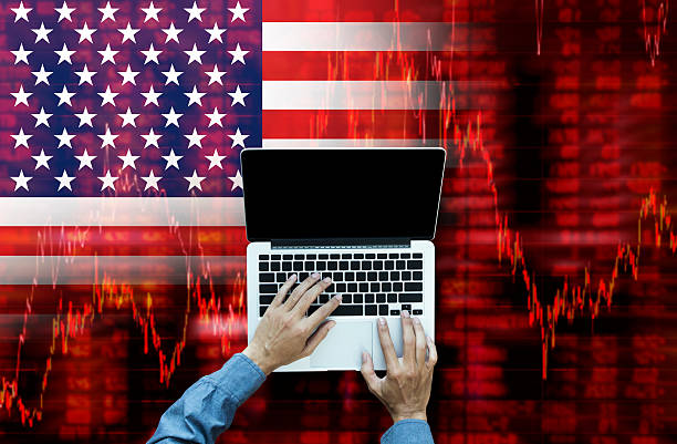 istock Working on laptop computer with Crisis in USA 621920666