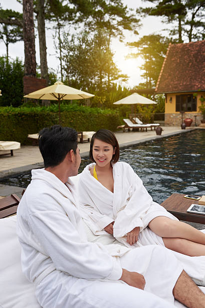 istock Honeymoon at swimming pool 621922784