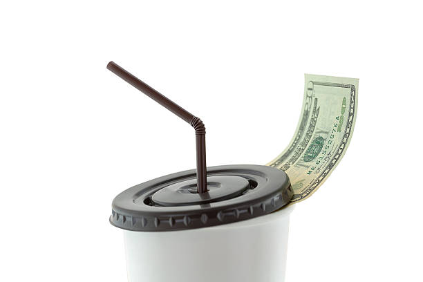 istock USD dollar banknote money leaving white paper cup for coffee 621923732