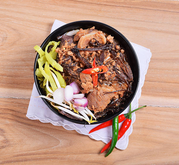 istock Rice noodles with spicy pork sauce 621924118