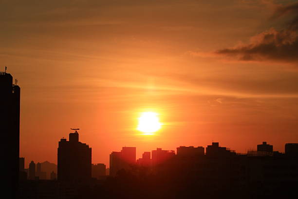 istock Sunset hk with building silhouette 621924280