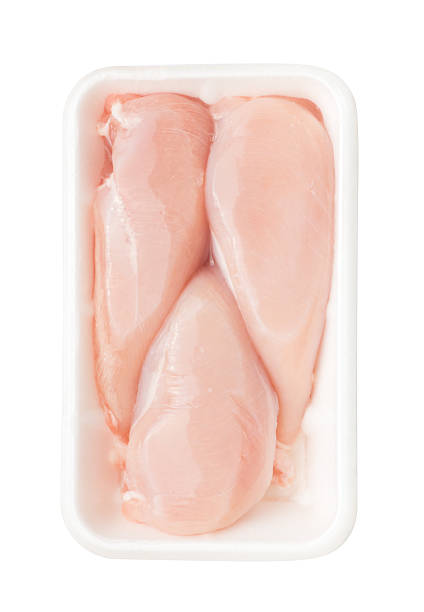 istock Meat. Raw chicken fillet package isolated on white background. Top 621925562