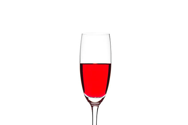 istock Red water in glass on white background 621927510