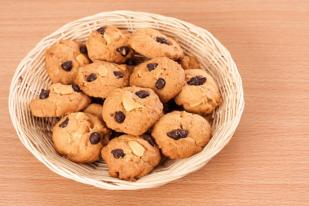 istock Cookies in basket on wooden ground 621927640