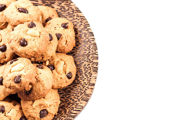 istock Cookies in wood dish on white back ground 621927684