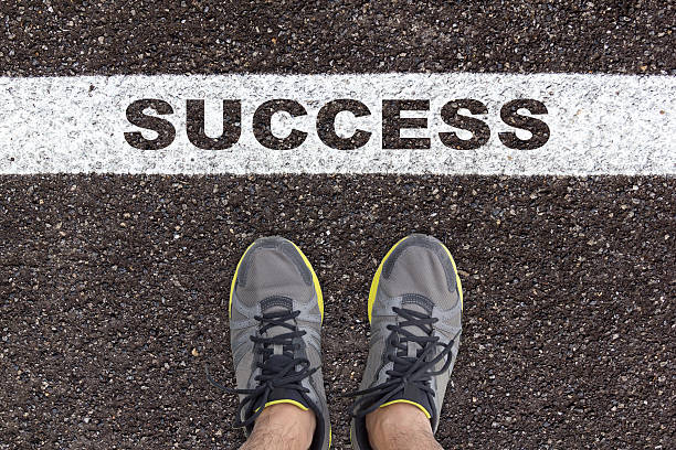 istock running shoe on asphalt road texture with success 621928484