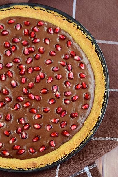 istock Chocolate tart with pomegranate seeds 621929398